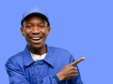 Man wearing a blue work uniform and cap, smiling and pointing to the right against a blue background.