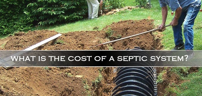 Person digging a trench for a septic system installation with black septic tank components visible.